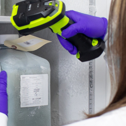 Lab staff scanning container in cryo storage